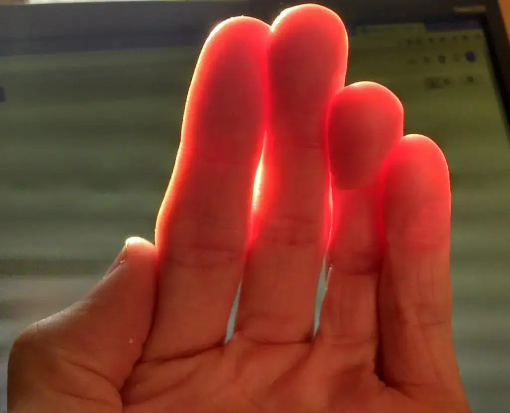 An example of sub-surfacing scattering is when holding a flashlight to your hand the light shines, some enters the skin and bounces around inside - causing it to scatter in all directions and escape at points that are away from where they entered. 